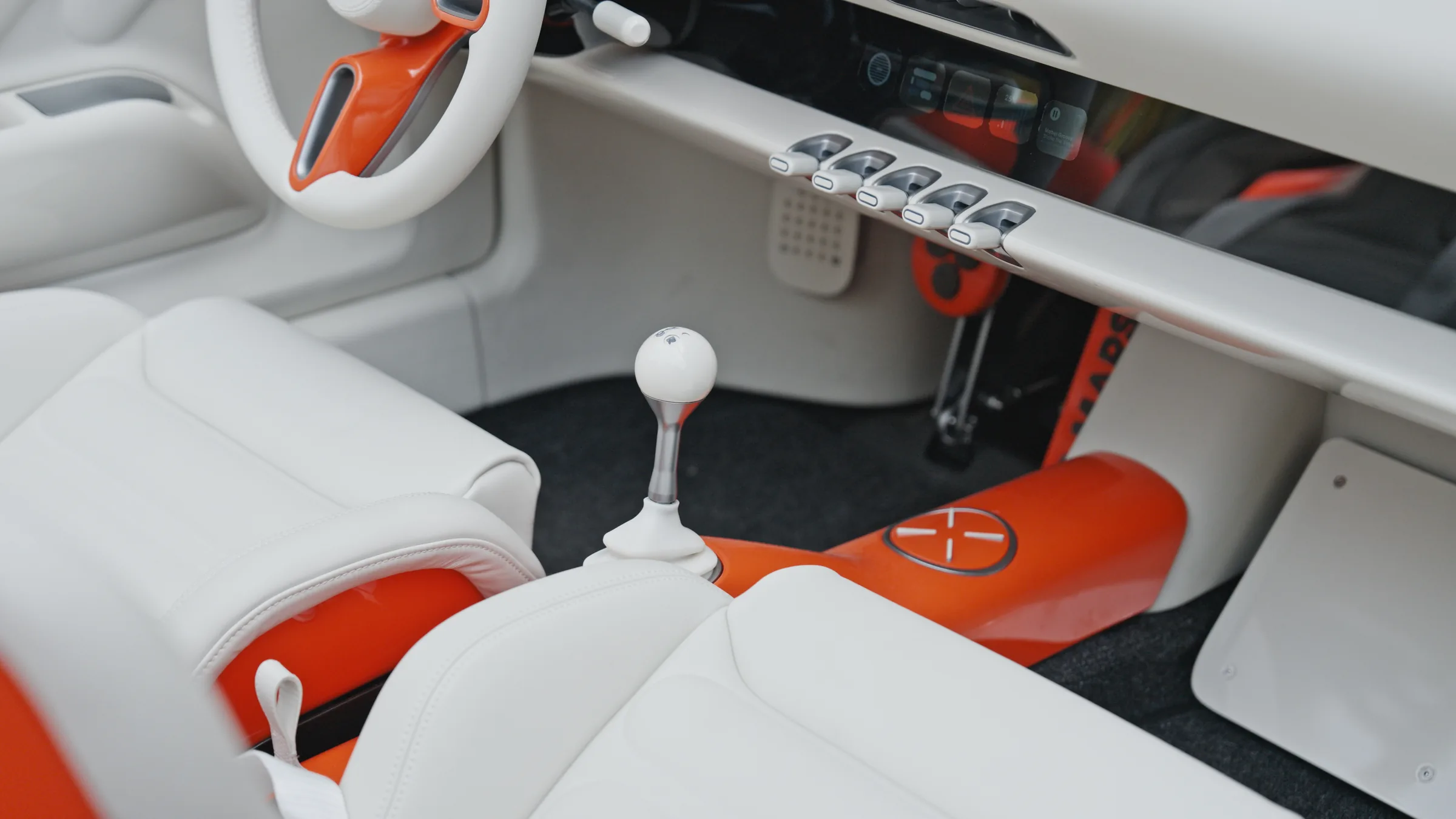 The white ball-topped gear selector on a slim steel stem